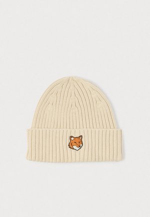Knit beige beanie with ribbed texture and a folded cuff, featuring an embroidered orange fox head on the front.
