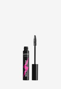 Tube de mascara noir avec une finition mate, arborant une étiquette rose sur laquelle est inscrit "vaut le détour". Comprend une brosse applicatrice longue en forme de peigne.