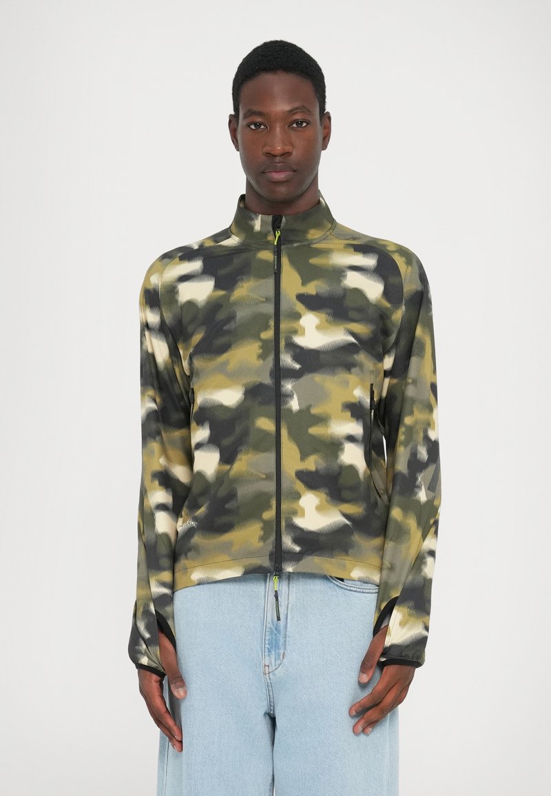 Camo-patterned zip jacket in green, beige, and gray shades. Features a high collar and thumbholes. Made from a lightweight, textured fabric.