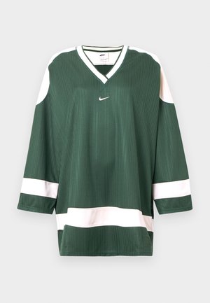 Vihreä urheilupaita kevyessä ribbineuloksessa, jossa on valkoisia yksityiskohtia ja V-kaula-aukko. Paidassa on Nike-logo rinnassa.