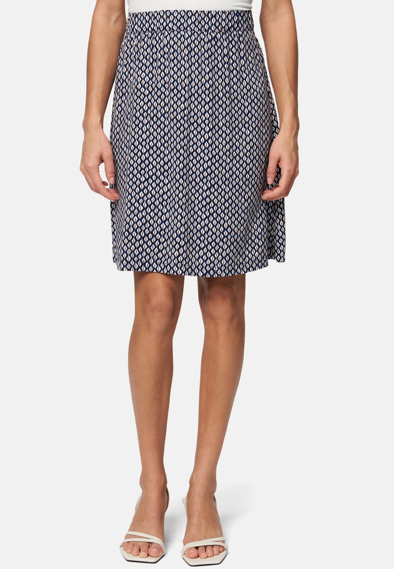 Jupe marine avec un motif de feuilles en blanc cassé ; dotée d'une taille élastique et d'un design évasé. Fabriquée en tissu léger et texturé.