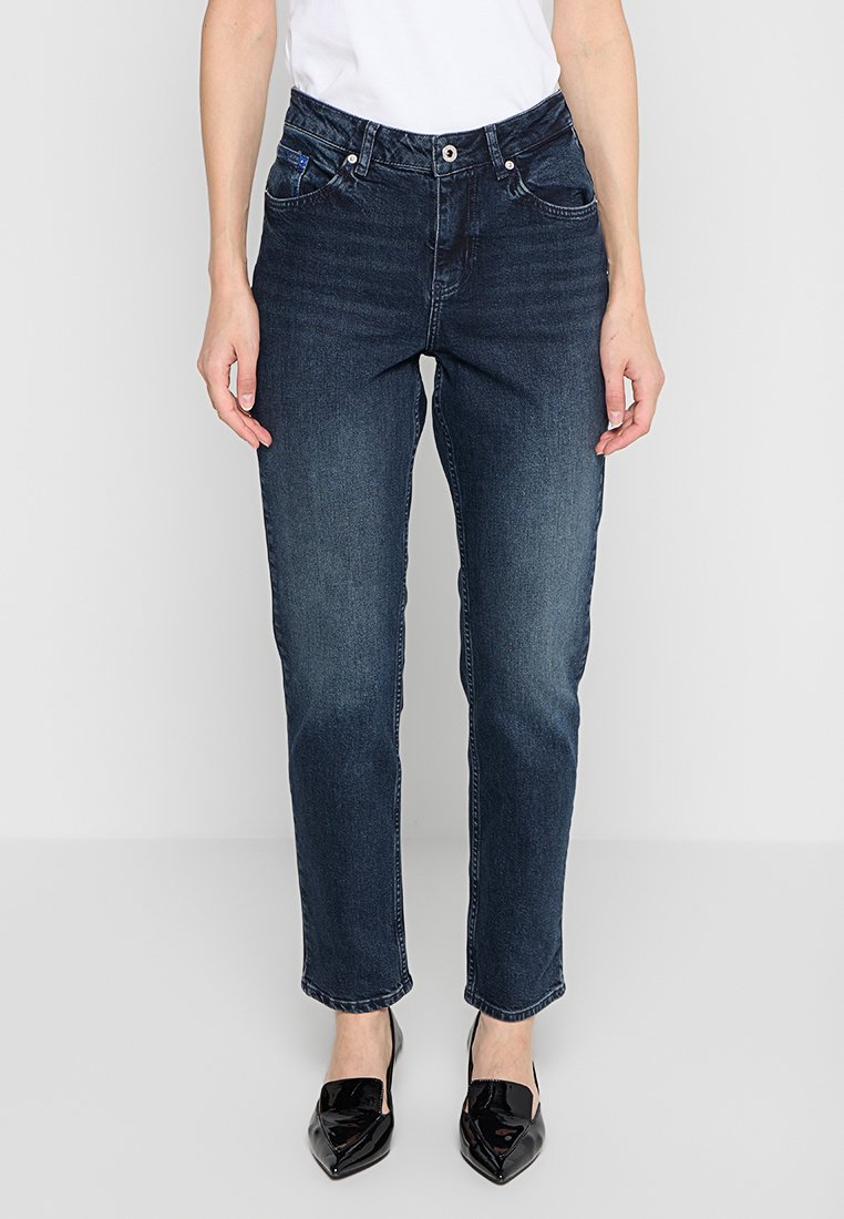 Dunkelblaue Denim-Jeans verfügen über ein gerades Bein-Design, mit Fronttaschen und einem Knopfverschluss. Der Stoff hat eine glatte Textur.