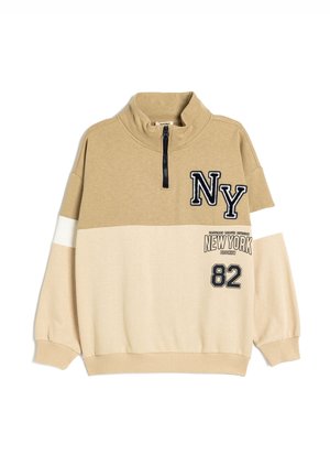 Pullover beige de media cremallera en mezcla de algodón con bordado negro "NY", rayas blancas y estampados "NEW YORK" y "82" en la parte delantera.