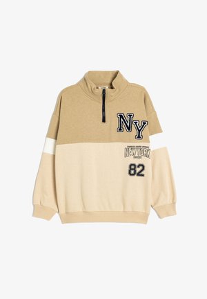 Pullover beige de media cremallera en mezcla de algodón con bordado negro "NY", rayas blancas y estampados "NEW YORK" y "82" en la parte delantera.