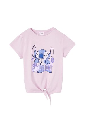 Light pink tied-hem t-shirt with short sleeves featuring a smiling blue Stitch character and purple flowers with "GOOD DAY" text.