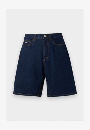 Ciemnoniebieskie szorty jeansowe z przednimi kieszeniami, zapięciem na guziki, widocznym pomarańczowym przeszyciem oraz małą naszywką z logo "obey" na prawej kieszeni.