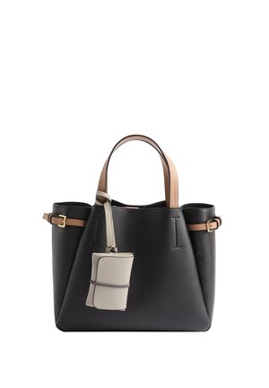 Black leather handbag with beige handles, side buckle straps, and an attached small beige pouch hanging from one handle.