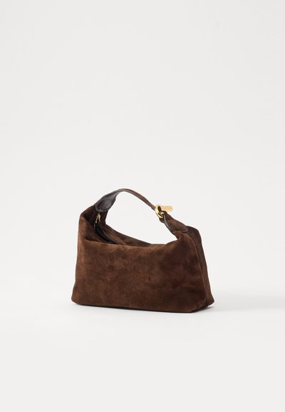 Brown suede handbag with a rounded shape, short handle, and gold-tone zipper closure. Soft texture with a minimalist design.