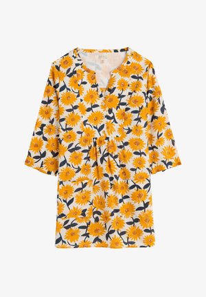 Geel bloemenblouse met driekwart mouwen, v-hals en knoopdetails. Heeft een witte achtergrond met opvallende zonnebloempatronen.