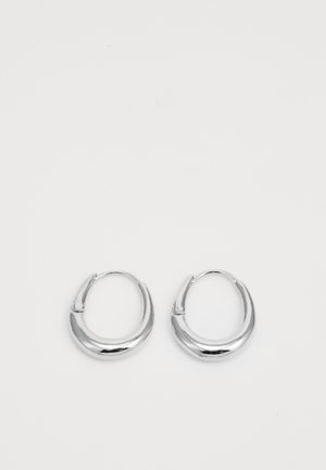 Silver hoop earrings with a smooth, polished finish. They have a rounded shape and a simple clasp design for secure wear.