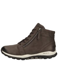 Zapato de cuero marrón de media caña con punta redonda, que cuenta con un zipper lateral, cordones en la parte frontal y suela de goma con detalles texturizados.