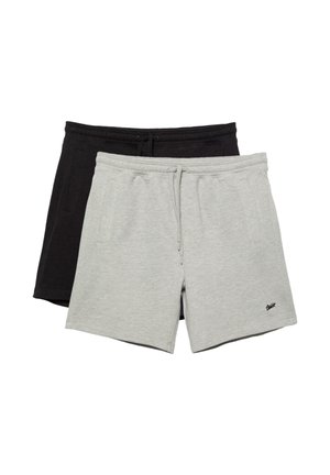 Dva páry voľných šortiek, jeden svetlosivý a jeden čierny, oba so šnúrkami a bočnými vreckami, rozložené na bielom pozadí s prekrývaním.