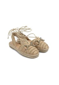 Beżowe sandały espadrille z plecionką z juty, sznurkami do wiązania i dekoracyjnymi akcentami z cyrkonii z przodu. Lekkie, płaskie podeszwy.