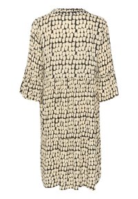 Zwart-gekleurde jurk met crème patroon, korte gerimpelde mouwen, ronde hals en een gelaagde constructie, met een textuur die lijkt op stippen overal.