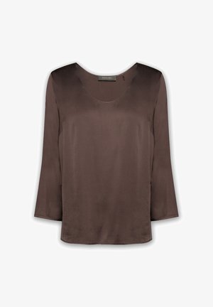 Blusa marrone a maniche lunghe realizzata in tessuto morbido, con scollatura rotonda e vestibilità leggermente ampia. Non presenta motivi visibili né accessori.