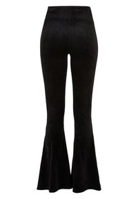 Svarta utsvängda kordbyxor med hög midja, mjuk textur och vertikalt ribbat mönster, som avsmalnar till en klockformad nederdel.