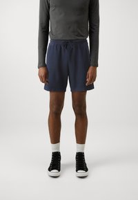 GAP Pantaloni de trening - tapestry navy
