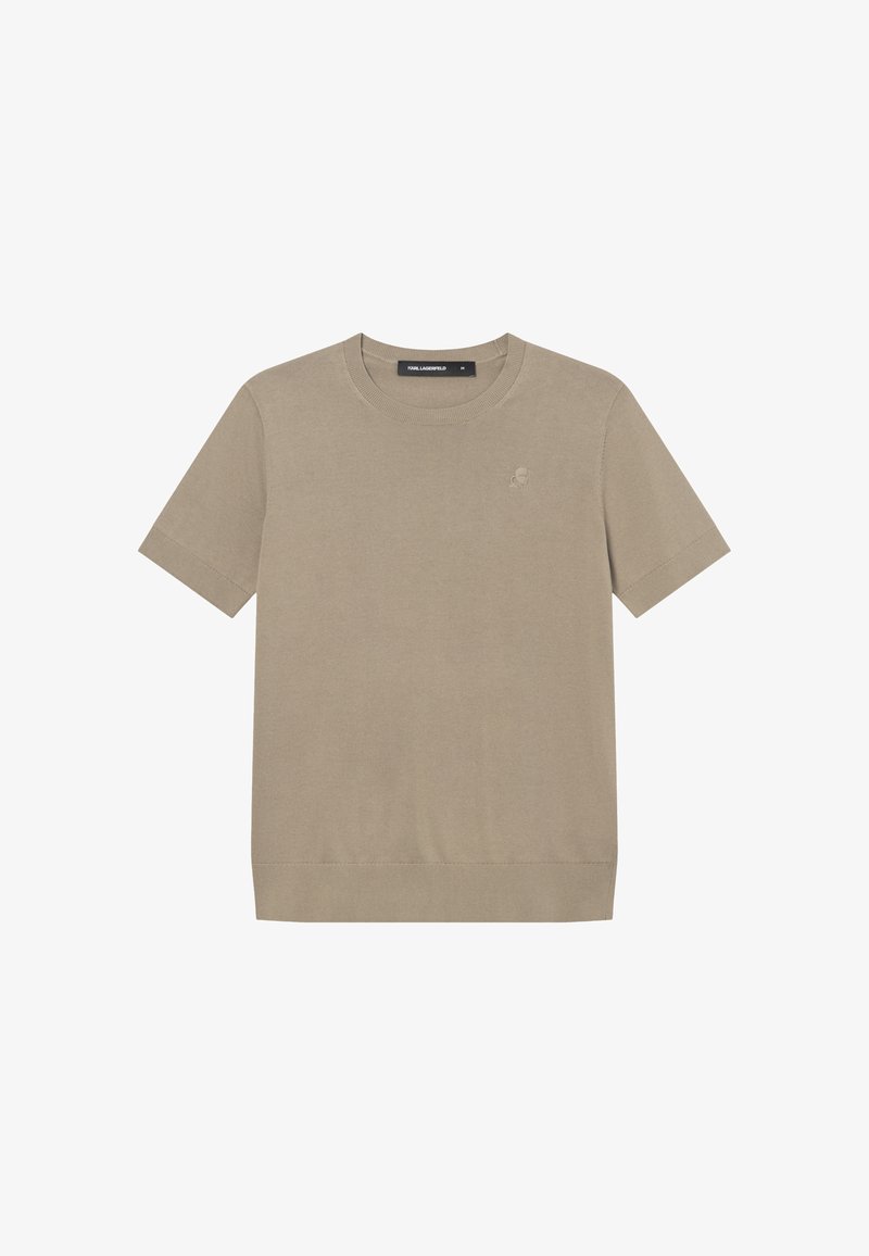 Chemise en maille beige à manches courtes avec col rond, ourlet ajusté et logo discret sur le côté gauche de la poitrine.