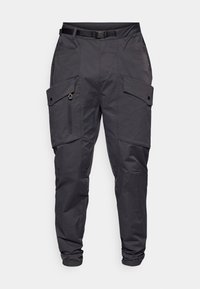 Cargo bukser i mørkegråt stoff med avslappet passform. Funksjoner inkluderer flere lommer, elastiske mansjetter og belte i livet for justerbar størrelse.