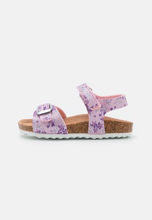 Child's purple sandal with floral pattern, cork footbed, white rubber sole, adjustable buckle and velcro straps, side view on white background.
