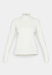 White long-sleeve athletic pullover with high collar and front quarter zipper, featuring subtle logo on left chest and thumbholes on sleeves.