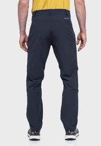 Marineblaue Outdoor-Hosen mit einem eleganten Design, aus leichtem Material gefertigt, mit vorgeformten Knien und elastischen Bündchen.