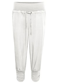 Pantaloni jogger grigi chiari con una larga cintura elastica, chiusura con cordino e polsini arricciati alle caviglie. Tessuto di consistenza liscia.
