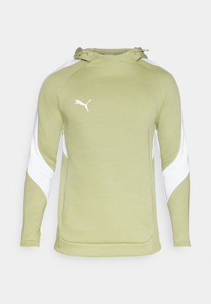 Gaiši zaļš kapucis ar baltām akcentiem un kangoru kabatu. Tam ir kapuce ar auklu un balta Puma logo uz krūtīm.