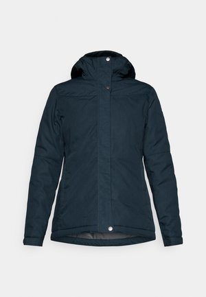 Navy blue insulated jacket featuring a high collar, hood, zip closure, and button accents. Smooth fabric with a slightly textured finish.