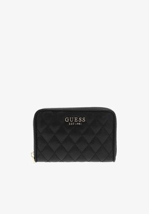 Sort quiltet pung med guldfarvet lynlås, med "GUESS EST 1981" logo i guldbogstaver på frontens midte.