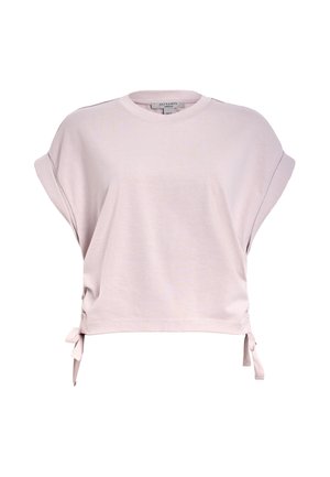 T-shirt rose clair à manches courtes en tissu doux. Doté d'un col rond, de liens sur les côtés et d'une coupe décontractée pour un port confortable.