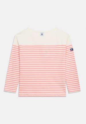 Pikkade varrukatega särk, mille ülaosa on kreemikas ja kere ning varrukad horisontaalselt korallivanikutes, vasakul varrukal on tumesinise värviga kaubamärgi märk.