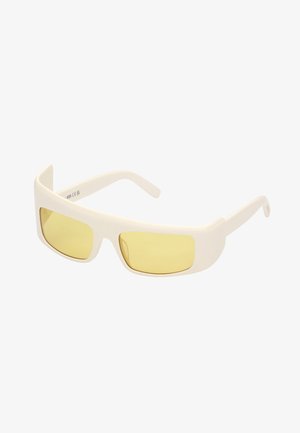 Gafas de sol blancas con lentes amarillos, forma rectangular, acabado mate y patillas delgadas. Presentan un diseño elegante y minimalista.