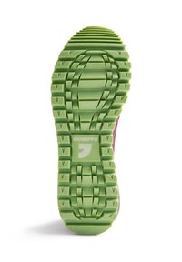 Semelle de chaussure en caoutchouc texturé vert avec des rainures multidirectionnelles et un logo central, conçue pour une traction et une durabilité optimales.