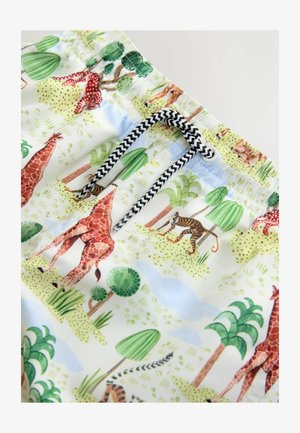 Krátke plávacie šortky s bielym pozadím, na ktorých je pestrý vzor zvierat, vrátane žiráf a tigrov, s čierno-bielou šnúrkou.