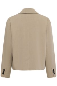 Beiger, gekürzter Blazer mit langen Ärmeln und schwarzen Knöpfen an den Manschetten, Ansicht von hinten.