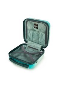 Valigia rigida turchese con un esterno liscio, rivestimento interno a motivi, scomparto con cerniera e cinturini regolabili per l'organizzazione.