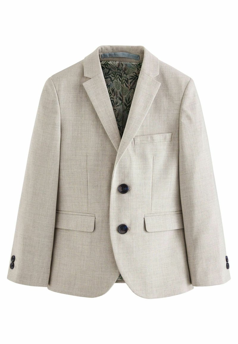 Ljus beige blazer i texturerat tyg, med två mörka knappar, en vänster bröstficka och ett grönt mönstrat foder.