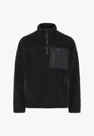 Črn flis pulover z visokim ovratnikom, četrt zadrgo spredaj in žepom na prsih iz kontrastnega materiala. Teksturna, mehka površina.