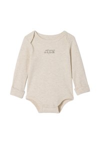 Beige long-sleeve onesie made from soft fabric. Features snap closures at the bottom and embroidered text: "petit amour de la famille."