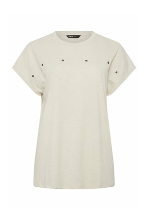 Top de manga corta color beige claro con escote redondo y detalles de botones de presión en el pecho y las mangas, corte holgado.