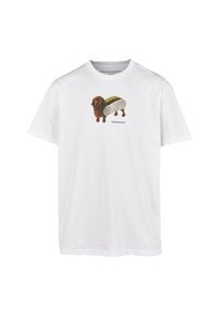 White cotton t-shirt featuring a graphic of a brown dachshund in a hot dog bun, with green and beige accents on the bun.