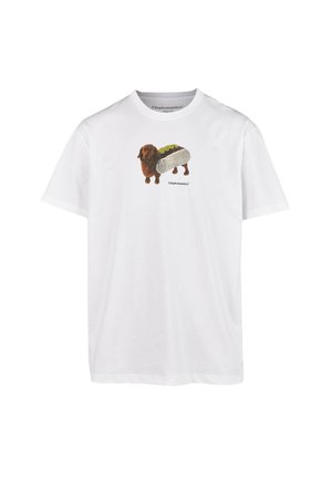 White cotton t-shirt featuring a graphic of a brown dachshund in a hot dog bun, with green and beige accents on the bun.