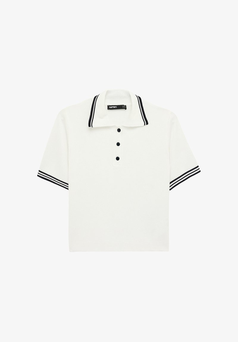 Biały polo z krótkim rękawem, czarnym obszyciem na kołnierzyku i rękawach oraz trzema czarnymi guzikami na przednim rozporku.