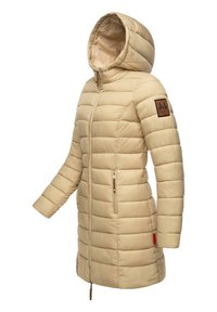 Beige long puffer jacket with quilted design, fitted hood, two side pockets, and a logo patch on the left sleeve. Lightweight material.