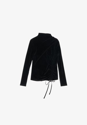 Mustmust pikkade varrukatega topp kõrge kaelusega ja külgkortsudega. Omab reguleeritava sünteetilise kehaosa detaili ääres. Pehme tekstuur.