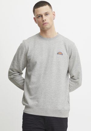 Gray sweatshirt with long sleeves, crew neck, ribbed cuffs, and hem. Features a small, colored embroidered design on the chest.