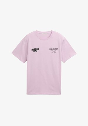 Light pink cotton t-shirt with short sleeves. Features black text graphics: "THE BEYOND REMIX" and "IT'S NOT THAT SERIOUS NEVER STAY THE SAME."