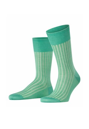 Green striped socks made of soft material, featuring a ribbed cuff and a subtle pattern of lighter green vertical stripes.
