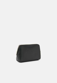 Black leather pouch with textured surface, gold zipper, and a rectangular shape. Compact design suitable for small items or cosmetics.